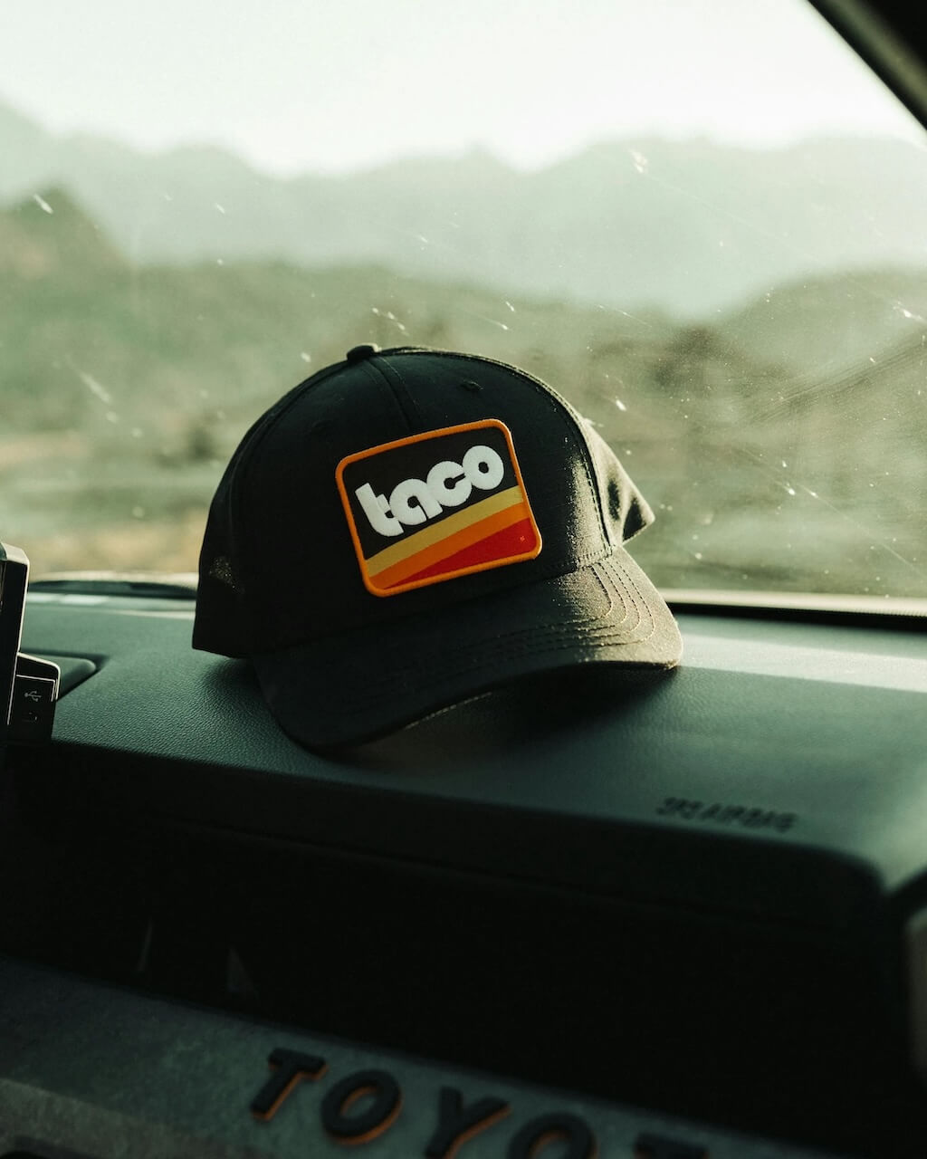 the new huckberry toyota collection - hat on dash of truck