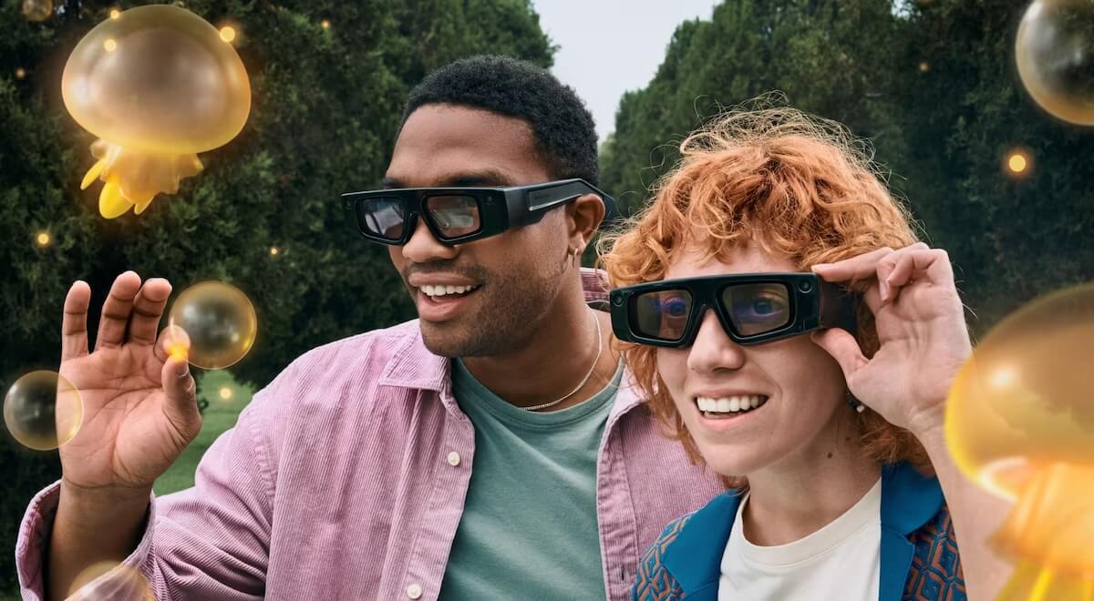 Two friends interacting with snapchat spectacles in AR