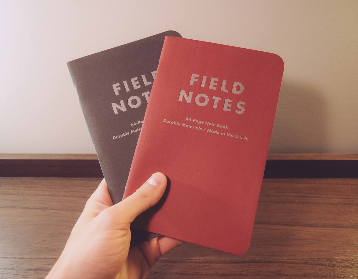 hand holding Field Notes notebooks